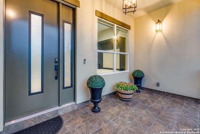 7812 Ventura Blvd, Selma, TX 78154 - view of exterior entry with stucco siding, elevator, and a patio