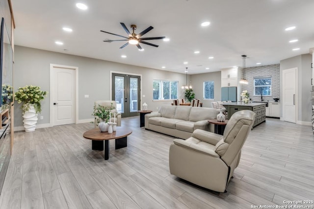 7812 Ventura Blvd, Selma, TX 78154 - living room with light wood-style floors, ceiling fan, recessed lighting, and baseboards
