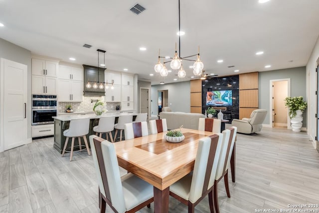 7812 Ventura Blvd, Selma, TX 78154 - dining room featuring a chandelier, recessed lighting, light wood-style flooring, and baseboards