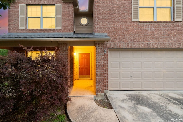 7603 Braun Bnd, San Antonio, TX 78250 - property entrance with brick siding and an attached garage