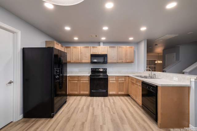 7603 Braun Bnd, San Antonio, TX 78250 - kitchen featuring black appliances, a sink, a peninsula, light brown cabinets, and recessed lighting