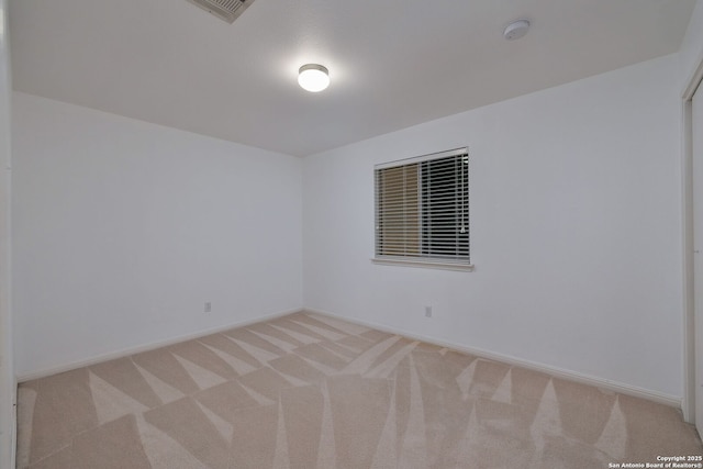 7603 Braun Bnd, San Antonio, TX 78250 - empty room with light colored carpet, baseboards, and a smoke detector