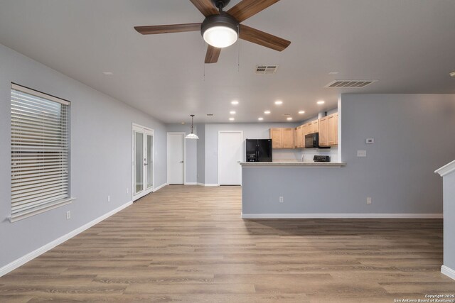 7603 Braun Bnd, San Antonio, TX 78250 - unfurnished living room featuring recessed lighting, light wood-style flooring, ceiling fan, and baseboards