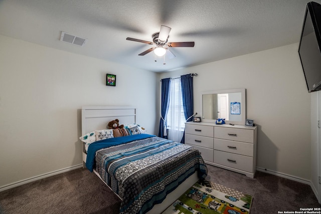 15323 Danae Bnd, San Antonio, TX 78245 - bedroom featuring dark carpet, ceiling fan, and baseboards