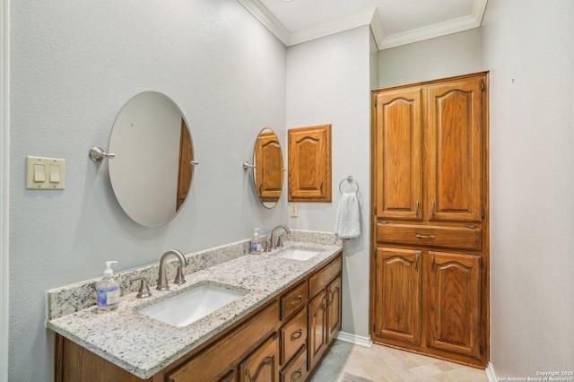 full bath with ornamental molding, double vanity, and baseboards