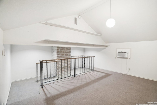 bonus room with carpet floors, vaulted ceiling, an AC wall unit, and baseboards