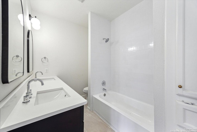 full bathroom with toilet, double vanity, bathing tub / shower combination, and marble finish floors
