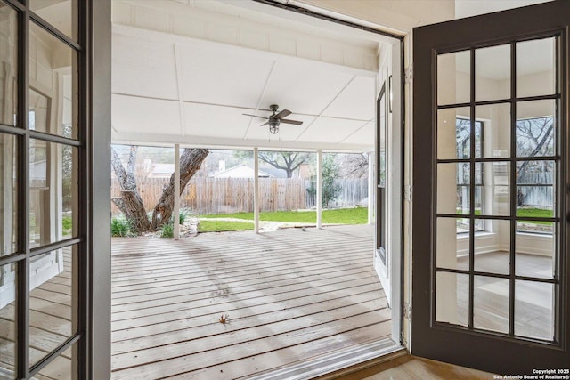 doorway with plenty of natural light and a ceiling fan