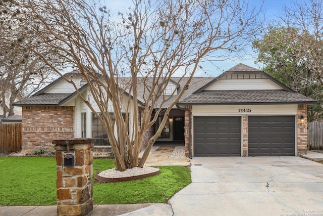view of front facade featuring driveway, a shingled roof, a garage, and brick siding