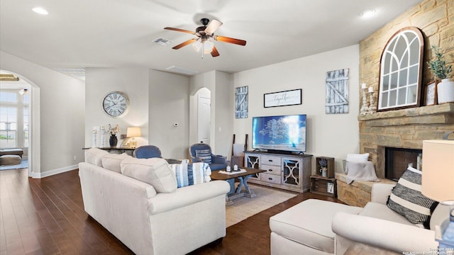 living room with arched walkways, ceiling fan, dark wood finished floors, and recessed lighting