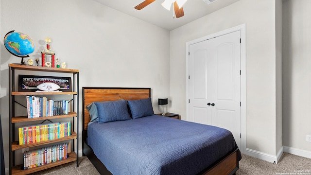 bedroom with carpet, baseboards, and a ceiling fan