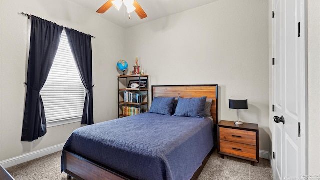 bedroom featuring carpet floors, baseboards, and ceiling fan