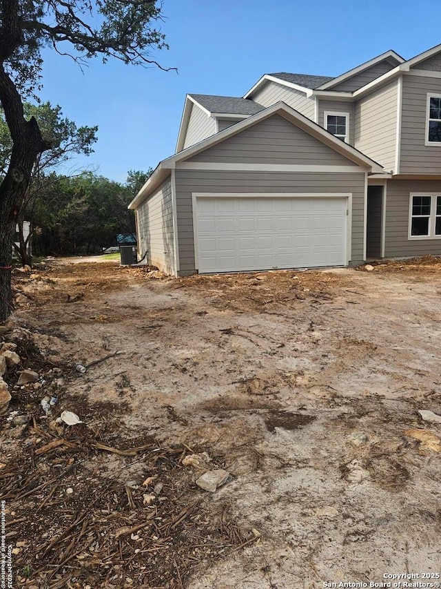 view of side of property with an attached garage