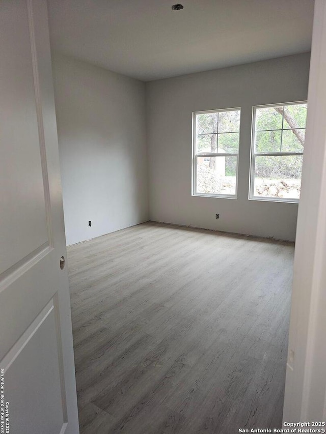 empty room featuring wood finished floors