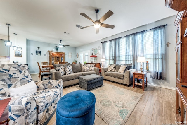 5249 Nature Path, Marion, TX 78124 - living room with a ceiling fan, light wood-type flooring, and baseboards