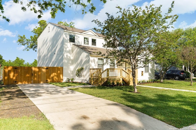 view of front of house with concrete driveway and a shingled roof