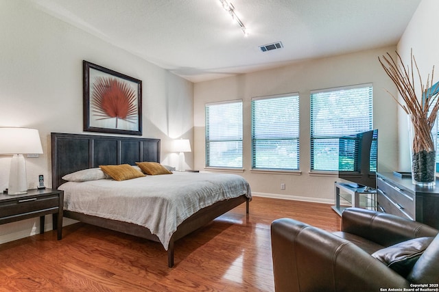 19119 Kristen, San Antonio, TX 78258 - bedroom featuring track lighting, wood finished floors, and baseboards