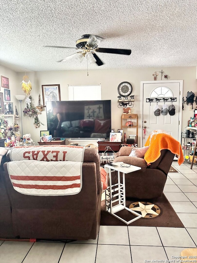 401/403 W Adams, Pleasanton, TX 78064 - living area featuring a ceiling fan, tile patterned floors, and a textured ceiling