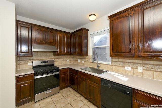 kitchen with stainless steel range with gas cooktop, dishwasher, under cabinet range hood, a sink, and tasteful backsplash