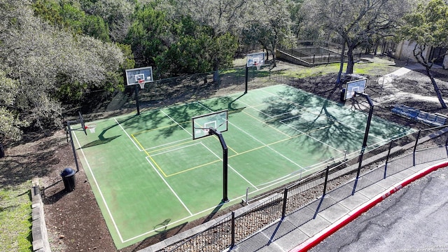 view of basketball court featuring community basketball court and fence