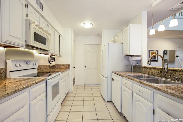 7930 Roanoke Unit 106, San Antonio, TX 78240 - kitchen with white appliances, a sink, light tile patterned floors, and white cabinets