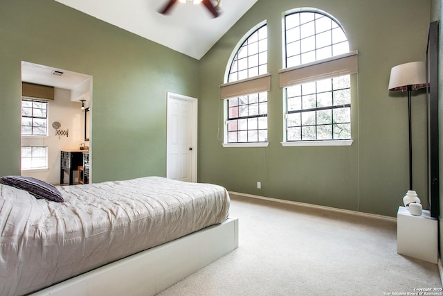 7930 Roanoke Unit 106, San Antonio, TX 78240 - bedroom with carpet flooring, high vaulted ceiling, ensuite bathroom, baseboards, and a ceiling fan