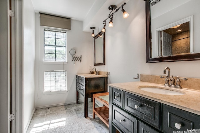 7930 Roanoke Unit 106, San Antonio, TX 78240 - full bath featuring two vanities and baseboards