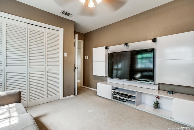 7930 Roanoke Unit 106, San Antonio, TX 78240 - living area featuring a ceiling fan, light colored carpet, and baseboards