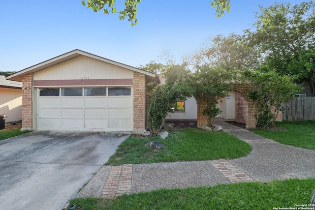 11731 Spring Rain, San Antonio, TX 78249 - view of front of home with brick siding, driveway, and a garage