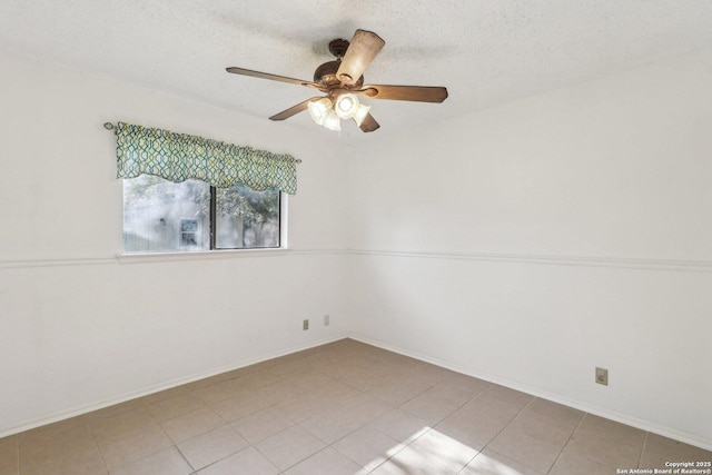 11731 Spring Rain, San Antonio, TX 78249 - unfurnished room featuring ceiling fan, a textured ceiling, baseboards, and light tile patterned floors