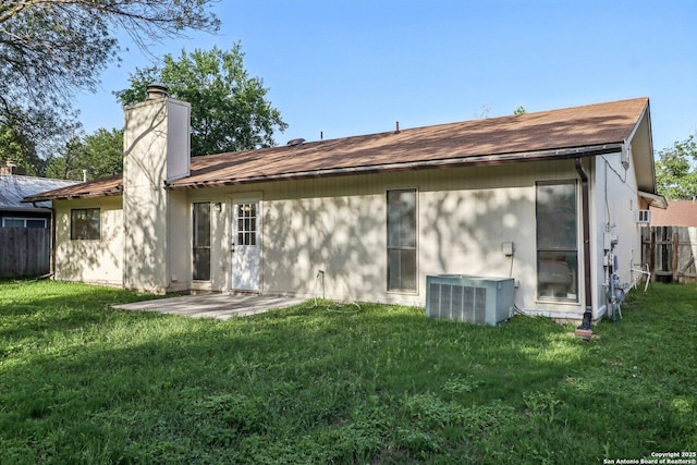 11731 Spring Rain, San Antonio, TX 78249 - rear view of property with central air condition unit, a chimney, and a patio area
