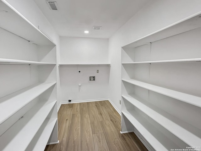 15827 Marisa, San Antonio, TX 78247 - washroom with gas dryer hookup, hookup for a washing machine, hookup for an electric dryer, wood finished floors, and recessed lighting