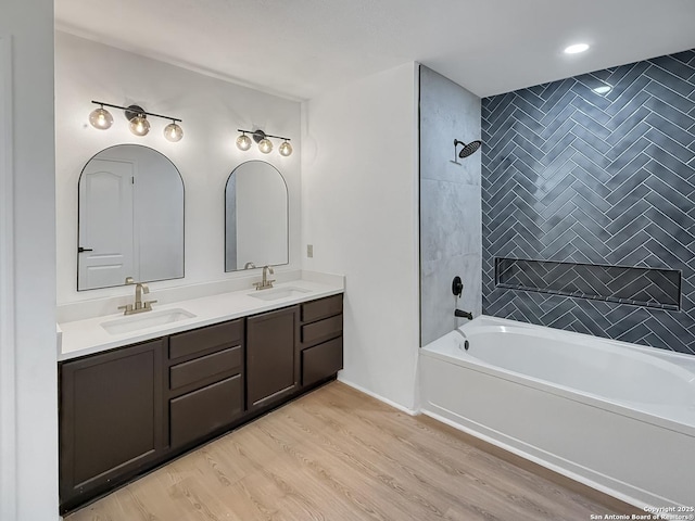 15827 Marisa, San Antonio, TX 78247 - full bath featuring shower / tub combination, double vanity, wood finished floors, and recessed lighting