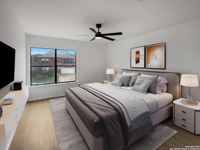 15827 Marisa, San Antonio, TX 78247 - bedroom featuring wood finished floors, ceiling fan, and baseboards