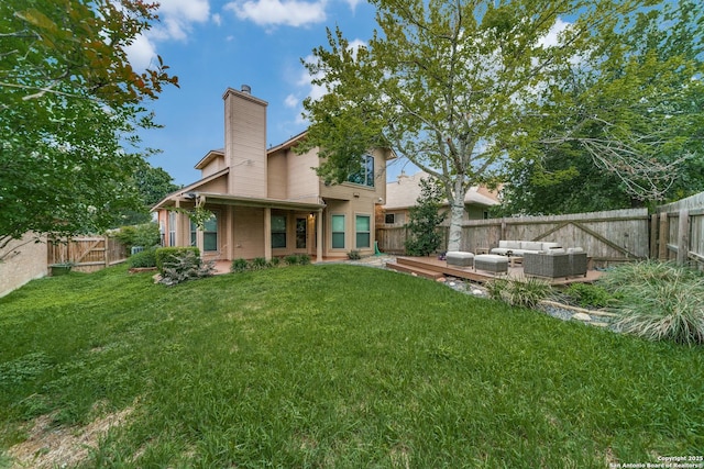rear view of property featuring outdoor lounge area, a chimney, and a patio area