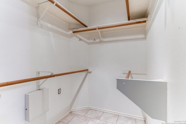 walk in closet featuring tile patterned flooring