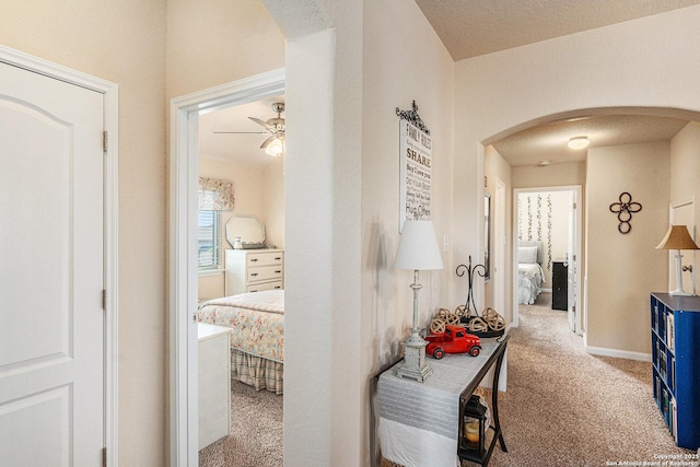 12338 Belfort Pt, Schertz, TX 78154 - hall with arched walkways and carpet floors