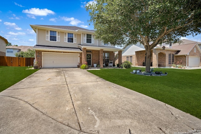 traditional home with brick siding, a garage, driveway, and covered porch