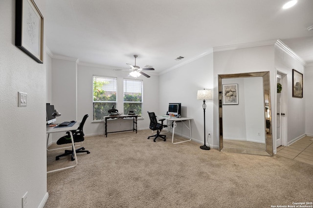 carpeted office with ornamental molding, a ceiling fan, and baseboards