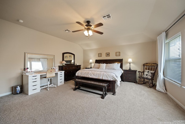 bedroom featuring carpet flooring, multiple windows, an office area, a ceiling fan, and lofted ceiling
