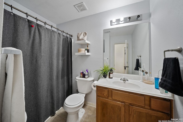 bathroom with toilet, vanity, tile patterned floors, a shower with shower curtain, and baseboards