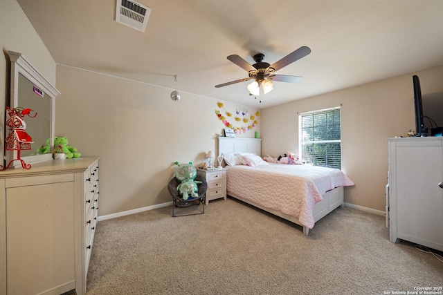 bedroom with light colored carpet, a ceiling fan, and baseboards