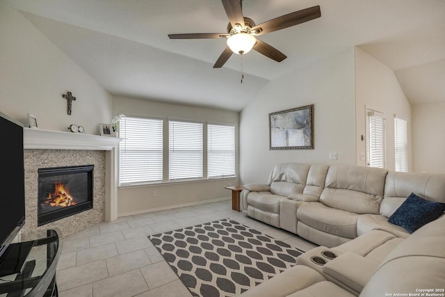 12243 Dusty Boots, San Antonio, TX 78254 - living area featuring vaulted ceiling, ceiling fan, light tile patterned flooring, and a tile fireplace