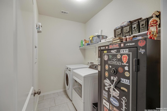 12243 Dusty Boots, San Antonio, TX 78254 - washroom with independent washer and dryer and light tile patterned floors
