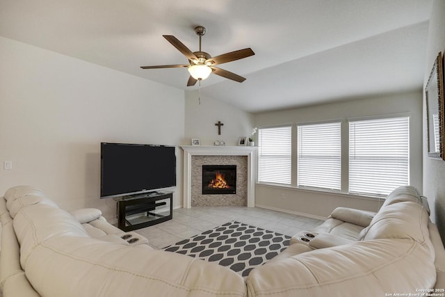 12243 Dusty Boots, San Antonio, TX 78254 - living area with lofted ceiling, a ceiling fan, light tile patterned floors, and a tile fireplace