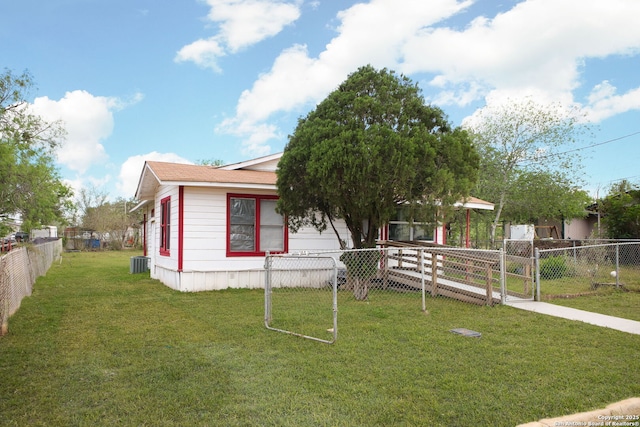 manufactured / mobile home featuring central air condition unit and a gate