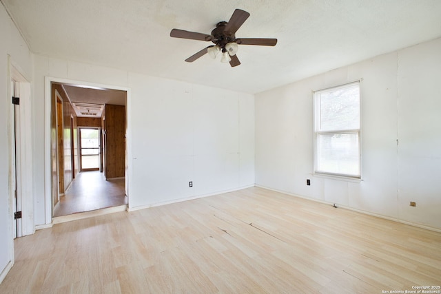 unfurnished room with wood finished floors and ceiling fan