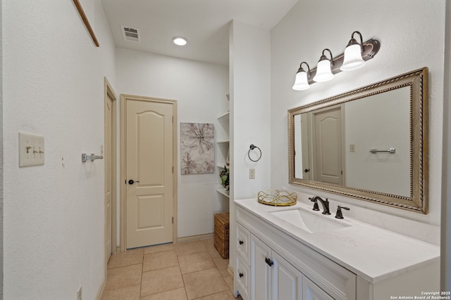107 River Knl, Castroville, TX 78009 - bathroom with vanity and tile patterned floors