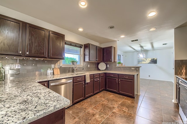 kitchen featuring stainless steel dishwasher, a peninsula, backsplash, recessed lighting, and light stone countertops