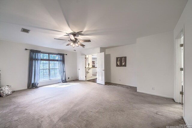 unfurnished bedroom featuring carpet flooring, a ceiling fan, and baseboards